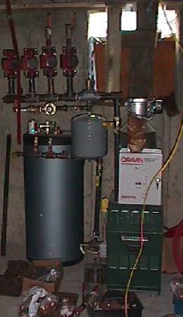 boiler with pumps, expansion tank, and hot water tank attached