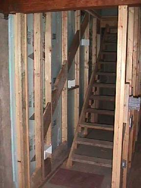 framed walls and temporary stairs in new basement stairwell