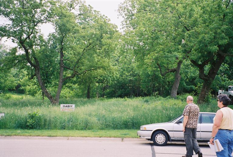 Architect Laura (right) accompanies Brian to the vacant lot we hoped to buy.