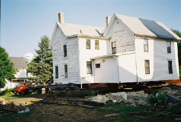 rear view of the home in Aug. 2003, lifted and partially slid from the foundation
