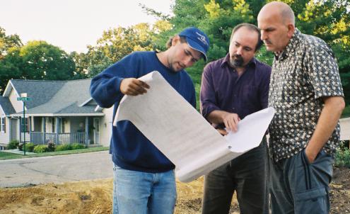 Travis, Ken and Brian review the site plan on site