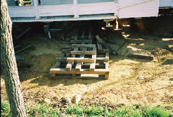 closeup of beams arranged to form a support base for house