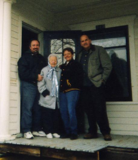 From left:  Ken, Grandma Ginger, Aunt Camille, and Brian on the front porch