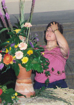 Lynn arranging flowers for our union ceremony in 1995